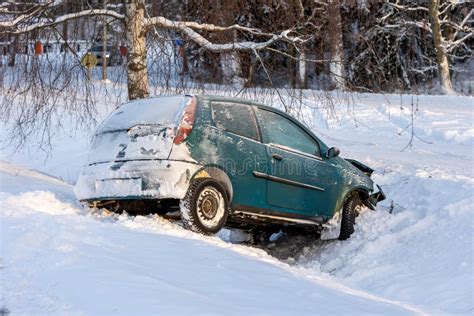 Car Accident In Winter Conditions Vehicle Wreck In A Ditch In Snow