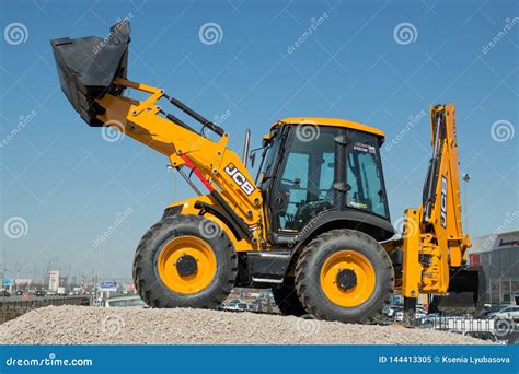 The Jcb Backhoe Loader Stands On The Advertising Stand In The South Of