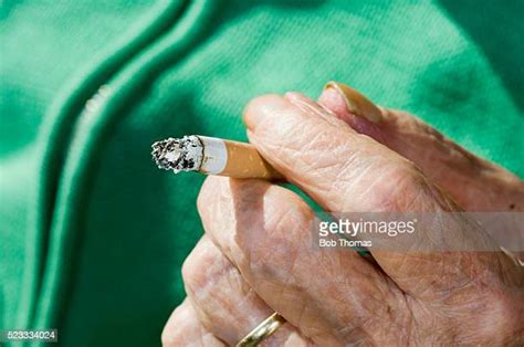 Elderly Woman Smoking Photos And Premium High Res Pictures Getty Images