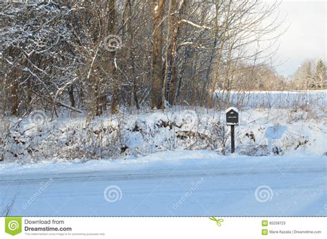 Snow Covered Mailbox On Rural Road On Winter Morning Stock Image