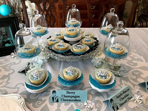 Holly golightly, played by audrey hepburn, wears a black evening gown, drinks coffee from a cardboard cup and eats pastry while browsing the windows. Breakfast at Tiffany's Theme Brunch - Debbee's Buzz ...
