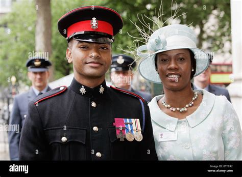private johnson beharry with victoria cross vc medal for bravery acompanied by his partner at