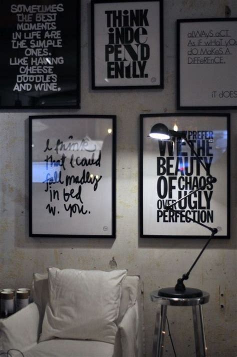 Black And White Posters On The Wall Above A Bed
