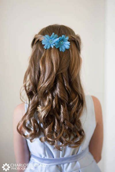 flower girl with blue flowers in her half up hairstyle deer pearl flowers