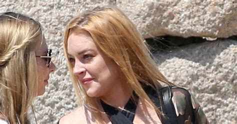 Lindsay Lohan Almost Bares Breasts Ditches Engagement Ring Us Weekly