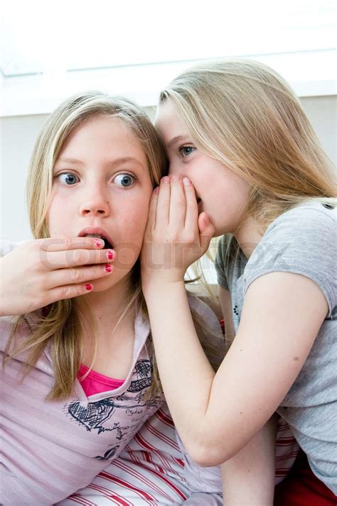 Two Teenage Girls Sharing Secrets Stock Image Colourbox