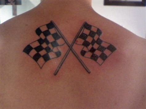 Two Crossed Checkered Flags On The Back Of A Man
