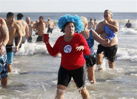 Thousands Of New Year S Revelers Take The Polar Bear Plunge For