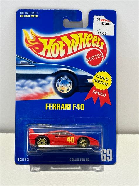 Ferrari F40 Uh Gold · Distribution Diecast64