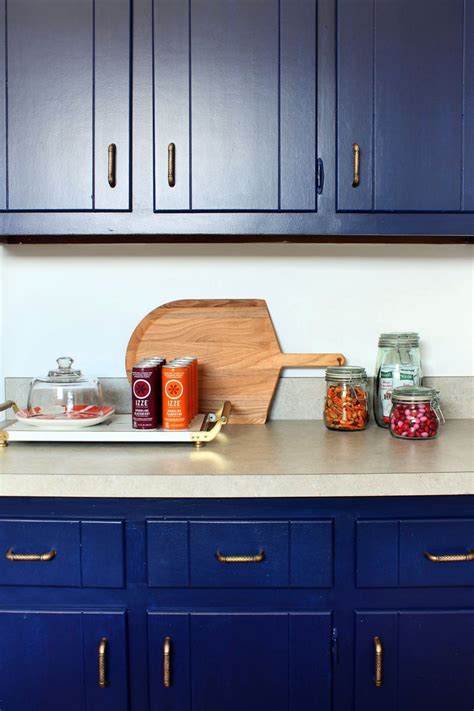 It is so lovely and i would love to see the whole room for. Glidden's Rich Navy covers the newly painted cabinetry ...