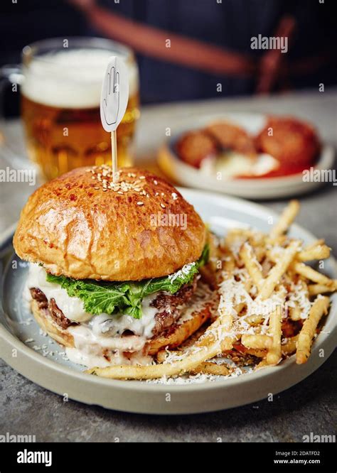 Hamburger Served With French Fries Stock Photo Alamy