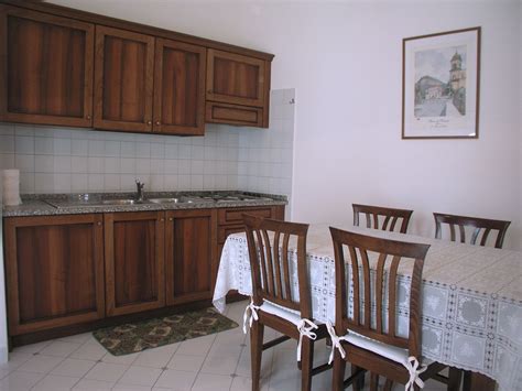 Click a photo to catch a glimpse of decor's signature cabinets. Kitchen - Antico Palazzo Scala, Sorrento