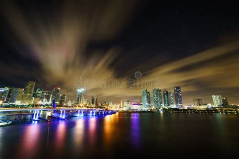 Miami City Skyline Panorama At Dusk With Urban Skyscrapers And Bridge