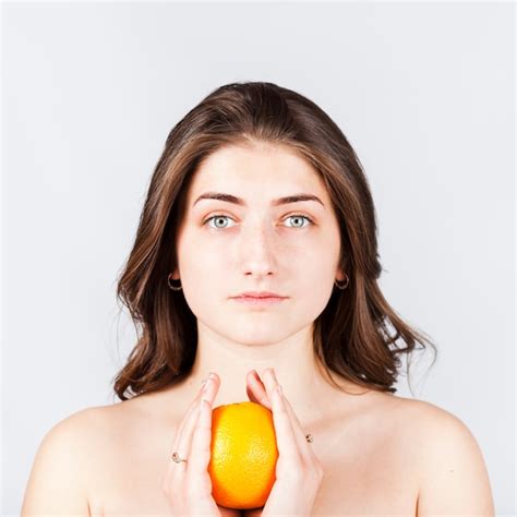 Free Photo Portrait Of Naked Woman Holding Orange