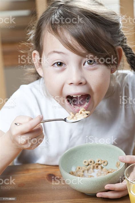 Girl Eating Cereal Stock Photo Download Image Now Breakfast Child