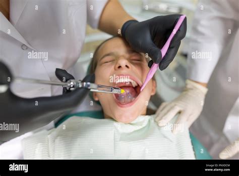 Dentist Makes Anesthetic Injection In The Gum Close Up Stock Photo Alamy
