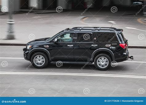 Fast Moving Black Toyota Sequoia Second Generation In City Road
