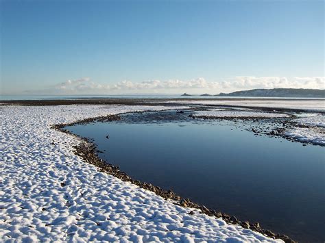 Swansea beach stretches for five miles along swansea bay between the maritime quarter and the knab the section of beach just outside victoria park is known as the slip.2 blackpill beach is. Swansea beach and the Mumbles - winter view | Wales now ...