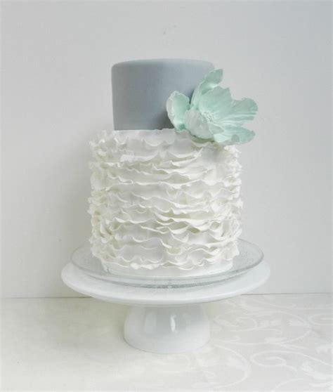 White Ruffles Light Grey Wedding Cake With Mint Green Sugar Flower
