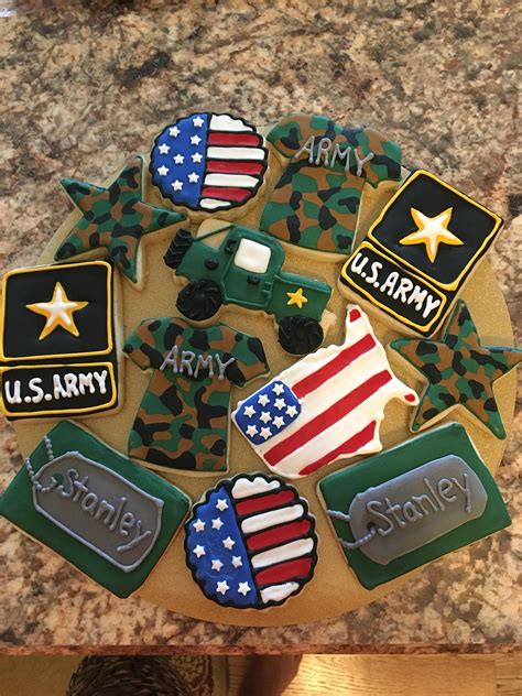 This army themed birthday consists of an army tank cake on top of a base cake with army boy, trucks, planes, rifles and grenade cupcakes. Army Cookies! | Crazy cookies, Army graduation party