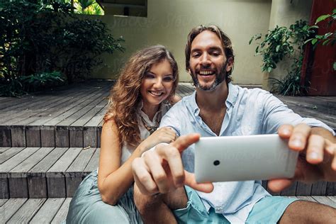 Smiling Couple Takes A Selfie By Stocksy Contributor Lumina Stocksy