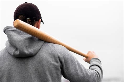 Premium Photo Back View Of Man Holding Baseball Bat On Shoulder
