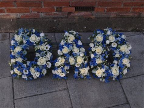 You may want to consider Loose Dad tribute blue and white - Funeral Flowers Southend