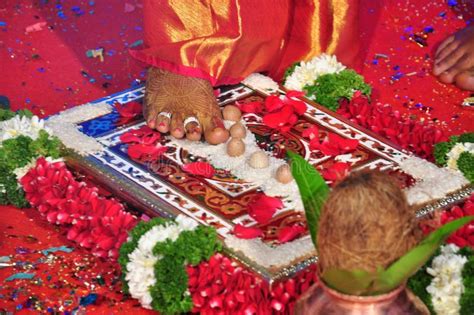 indian wedding ceremony bride and groom taking seven oaths with seven rounds around fire stock