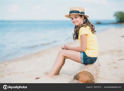 Little Girl Sitting On Beach Stock Photo By ©alebloshka 160970278