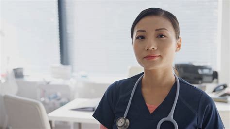 Portrait Of Smiling Female Doctor Wearing Stock Footage Sbv 335970118