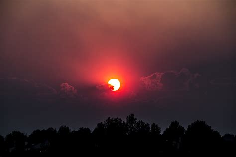 Red Sun Sun Shines Red As Wildfire Smoke Covers The Clouds Kyle