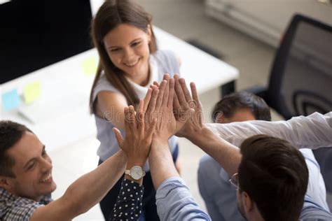 Close Up Of Coworkers Give High Five Motivated For Success Stock Image