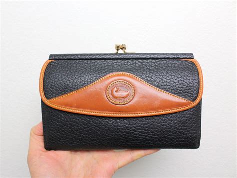 Vintage Dooney And Bourke All Weather Leather Tri Fold Wallet Black And