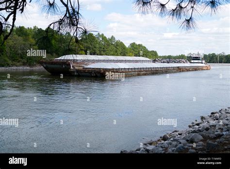 Tugboat Pushes A Barge Westward On The Intracoastal Waterway Through