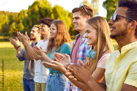 Happy People Applauding At An Outdoor Summer Festival Multiracial Male
