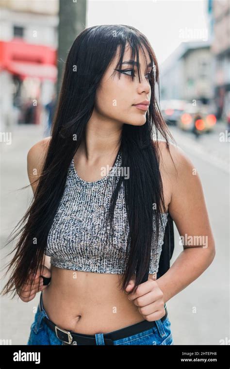 Beautiful Brown Skinned Latina Girl Walking Down The Street In The City