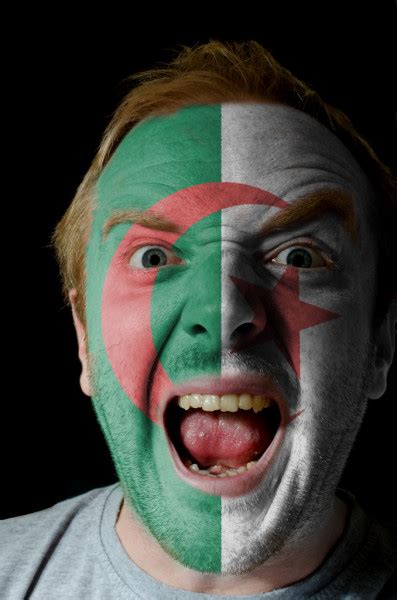 Face Of Crazy Angry Man Painted In Colors Of Latvia Flag — Stock Photo