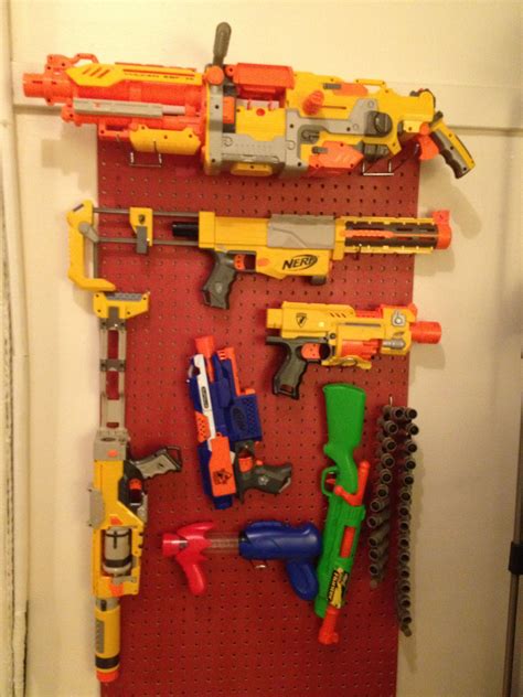 Like most 11 year olds, mine is nerf obsessed. Diy nerf gun peg board gun rack organizer | Daniel | Pinterest | Display, Nerf gun storage and ...