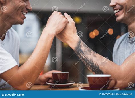Cheerful Male Telling With Friend At Desk Stock Image Image Of Cafe