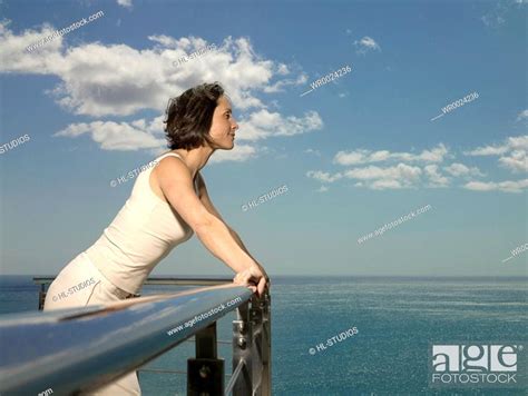 Side Profile Of Woman Leaning On Railing Stock Photo Picture And