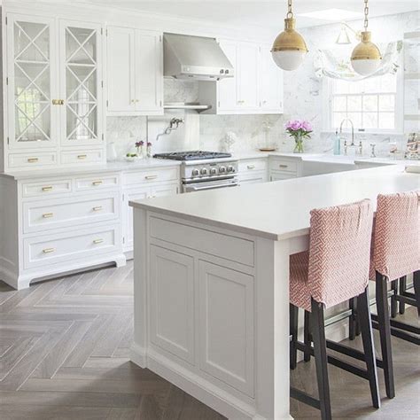 White Kitchen With Bleached Hardwood Flooring In