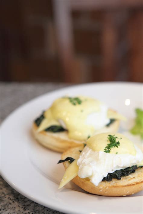 Tender poached eggs and wilted spinach are drizzled with hollandaise in this elegant brunch classic. Classic eggs Florentine | MummyPages.ie