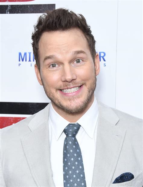 Chris Pratt Jokes With Photographers As He Hunks Out In Grey Suit At