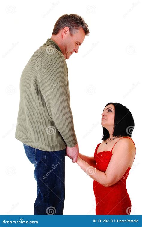 A Woman Is Kneeling For The Man Stock Photo Image Of Face