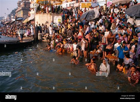 crowds of pilgrims on the ghats of the river ganges at varanasi during the kartik purnima