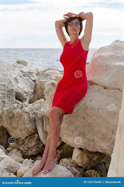 Woman On Rocky Beach Royalty Free Stock Image 43216864