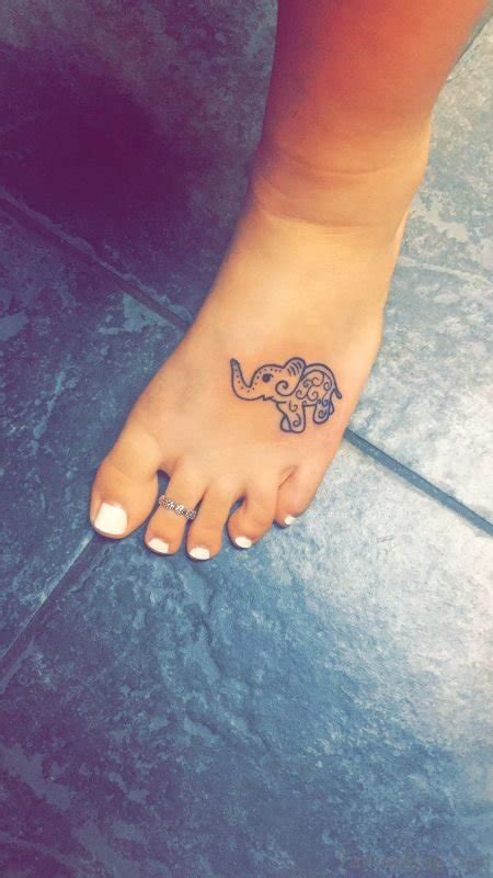 This one goes more on the delicate side on top of the foot with a few leaves and vines with no thorns in sight. 34 Terrific Elephant Tattoos On Foot
