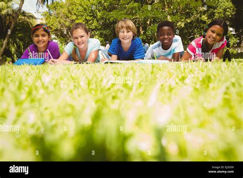 Children Doing Homework At Park Stock Photo Alamy