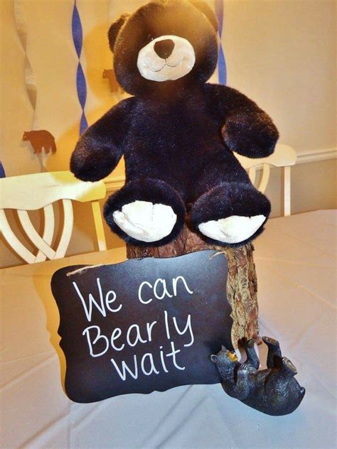 Black forest decor makes a rustic lamp featuring three black bears climbing on each others' shoulders to reach a bee's nest! "We can bearly wait" sign for bear-themed baby shower ...