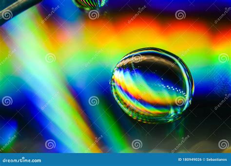 Light Diffraction Showing Rainbows On Water Drops Royalty Free Stock